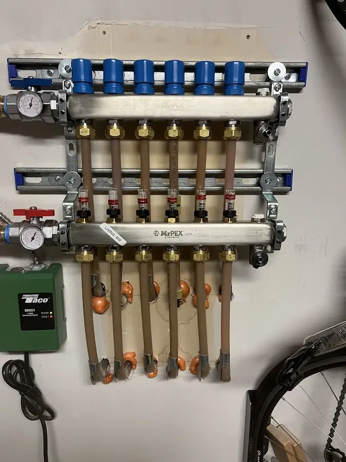 Plumber performing Water Heater Repair at a residential property in Avon